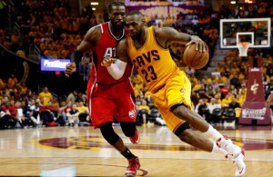 CLEVELAND, OH - MAY 26: LeBron James #23 of the Cleveland Cavaliers drives with the ball against DeMarre Carroll #5 of the Atlanta Hawks in the third quarter during Game Four of the Eastern Conference Finals of the 2015 NBA Playoffs at Quicken Loans Arena on May 26, 2015 in Cleveland, Ohio. NOTE TO USER: User expressly acknowledges and agrees that, by downloading and or using this Photograph, user is consenting to the terms and conditions of the Getty Images License Agreement. (Photo by Gregory Shamus/Getty Images)