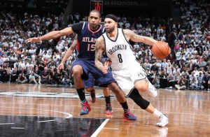 BROOKLYN, NY - APRIL 27: Deron Williams #8 of the Brooklyn Nets drives to the basket against Al Horford #15 of the Atlanta Hawks  during Game Four of the Eastern Conference Quarterfinals during the NBA Playoffs on April 27, 2015 at Barclays Center in Brooklyn, NY. NOTE TO USER: User expressly acknowledges and agrees that, by downloading and/or using this Photograph, user is consenting to the terms and conditions of the Getty Images License Agreement. Mandatory Copyright Notice: Copyright 2015 NBAE (Photo by Nathaniel S. Butler/NBAE via Getty Images)